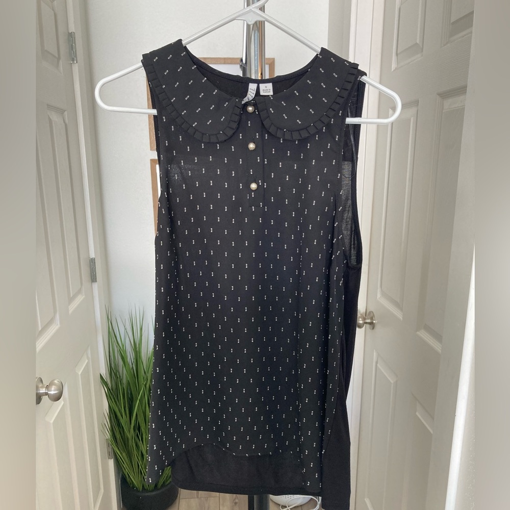 Size small- brand “ELLE”- like new- lightweight-sleeveless professional blouse.